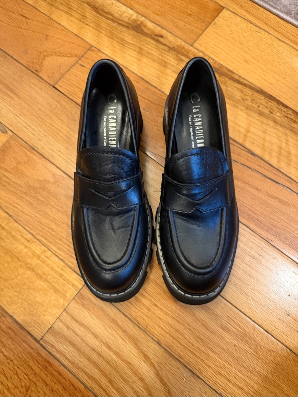 La CANADIENNE Black Leather Lug Sole Penny Loafers